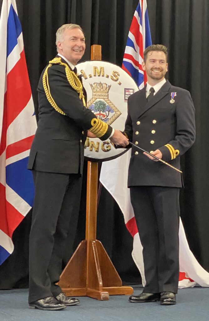Photo of Admiral Radakin presenting the OA Sword to Lieutenant Will Hope